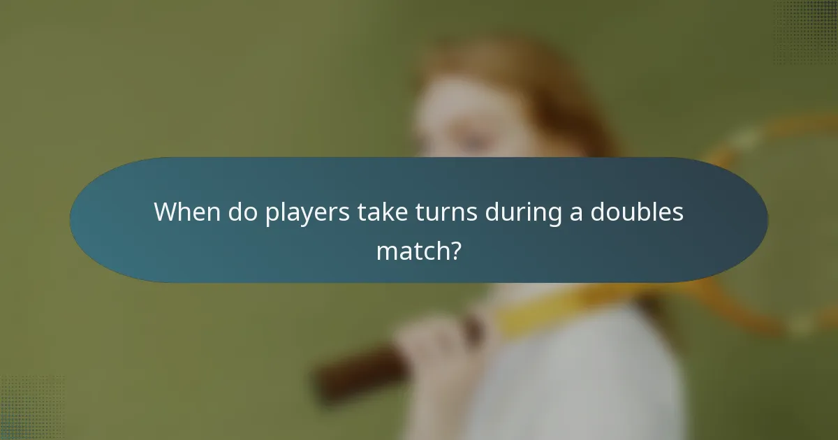 When do players take turns during a doubles match?